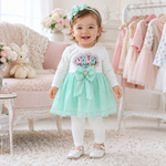 Baby girl wearing mint green Mama bow frock top with white pajama