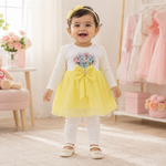 Baby girl wearing yellow Mama bow frock top with white pajama
