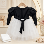 Back view of black and white baby girls party frock suit with pajama and black waist tie