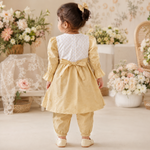 Back view of mustard yellow baby girls frock suit with matching pajama and bow detail