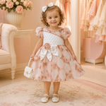 Back view of peach floral baby girls frock suit with white tie and zipper