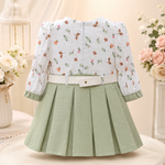 Front view of sage green baby girls frock suit with white pajama, belt and floral sleeves